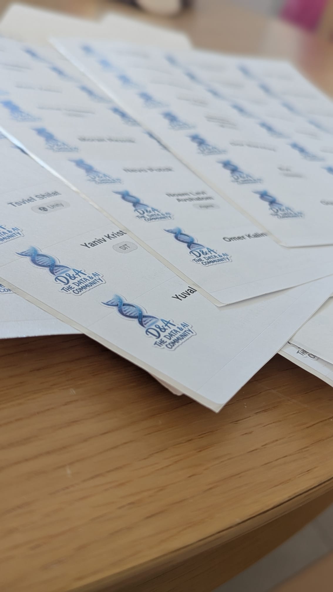 Printed D&A name badges laid out on a table before doors opened